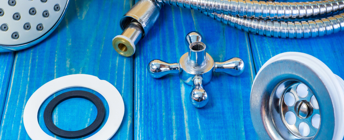 plumbing tools on top of a blue wood table