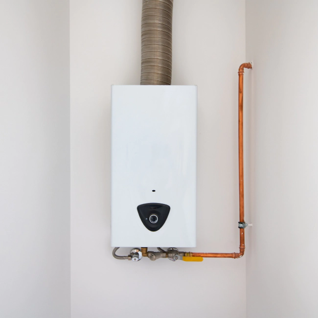 white water heater attached to a beige wall with orange lines